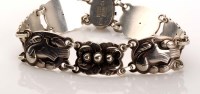 Lot 953 - Georg Jensen: a silver bracelet composed of...