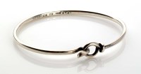 Lot 956 - Georg Jensen: a silver bangle of plain design...