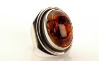 Lot 959 - Herman Siersbol: a silver and amber ring, the...