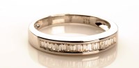 Lot 964 - A half hoop diamond eternity ring, the mount...