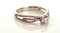 Lot 968 - A diamond ring, the central brilliant cut...