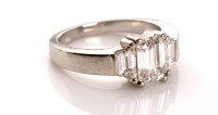 Lot 973 - A diamond ring, the emerald cut diamond...