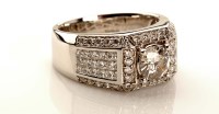 Lot 979 - A gentleman's diamond dress ring, the...