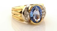 Lot 980 - A contemporary sapphire and diamond dress ring,...