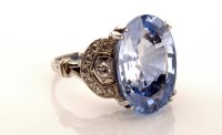 Lot 981 - A contemporary diamond and sapphire ring, the...