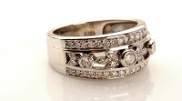 Lot 982 - A diamond dress ring, the central section set...