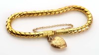 Lot 996 - A Victorian gold bracelet, c.1870, the snake...