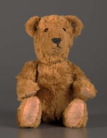 Lot 1119 - A mid 20th Century brown plush Steiff teddy...