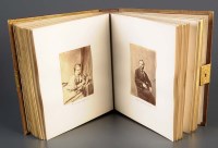 Lot 1139A - A Victorian album of cartes de visite and...