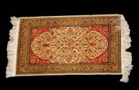 Lot 1237 - A small modern silk Persian rug, decorated...