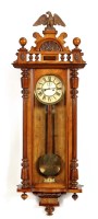 Lot 1245 - A late 19th Century walnut Viennese wall clock,...