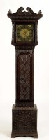 Lot 1248 - A carved oak longcase clock, the brass roman...