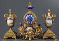 Lot 1252 - A French gilt metal and porcelain three-piece...