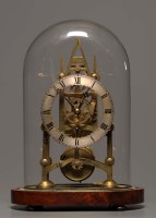 Lot 1255 - A brass skeleton clock, silver roman chapter...