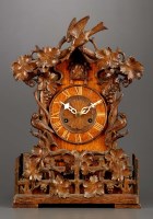 Lot 1259 - A late 19th Century carved oak cuckoo clock,...