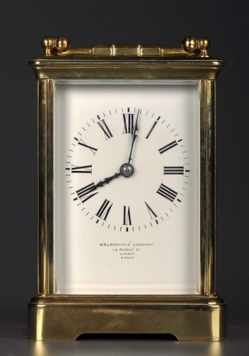 Lot 1274 - A French brass carriage clock, enamelled roman...