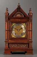 Lot 1281 - A late 19th Century carved oak mantel clock,...