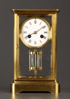 Lot 1282 - A French brass four-glass mantel clock, with...