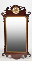 Lot 1301 - A George III mahogany parcel gilt wall mirror,...