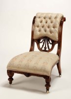 Lot 1317 - A Victorian walnut nursing chair with buttoned...