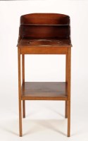 Lot 1335 - A Georgian mahogany washstand with curved...