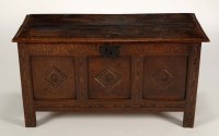 Lot 1344 - An oak coffer, the twin-plank top opening to...