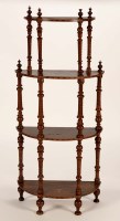 Lot 1345 - A Victorian walnut and inlaid four-tier...