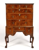 Lot 1382 - An early Georgian walnut cabinet-on-stand...