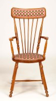 Lot 1399 - A stained ash country chair, the round seat...