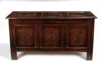 Lot 1401 - An oak coffer, the three-panel lid opening to...