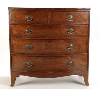 Lot 1409 - A late Georgian mahogany bowfront chest of two...