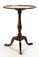 Lot 1411 - A Georgian mahogany tip-up-top tripod table,...