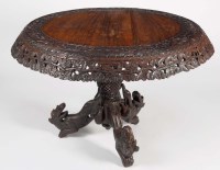 Lot 1414 - A Burmese carved hardwood circular-shaped...