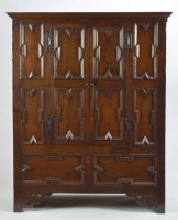 Lot 1415 - A Jacobean style oak armoir, with flared...