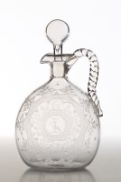 Lot 230 - † An engraved spirit jug, with rope handle and...