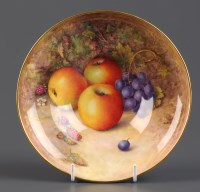 Lot 271 - Royal Worcester: a bowl painted with fruits on...