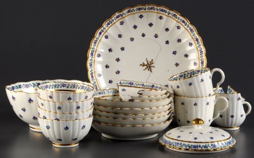 Lot 279 - † A part porcelain tea service, of ribbed form,...