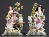 Lot 295 - † A pair of Chelsea style figural candlesticks,...