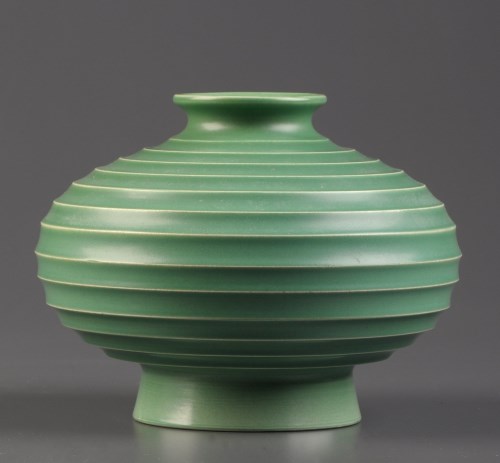 Lot 320 - Keith Murray for Wedgwood: a squat ribbed vase,...