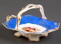 Lot 325 - † An English porcelain basket, with Saxe Blue...