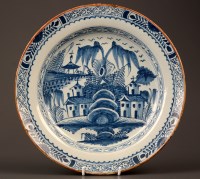 Lot 343 - An 18th Century delft plate, typically...