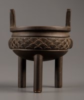 Lot 434 - A bronze censer, Ding, with stylised wave band...