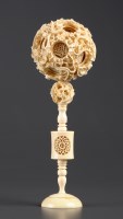 Lot 440 - An ivory puzzle ball, comprising ten balls,...