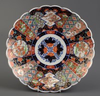 Lot 457 - An Imari charger, with scalloped edge, painted...