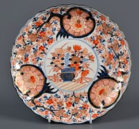 Lot 466 - An Imari plaque, painted with central vase and...