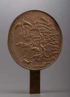 Lot 470 - A bronze mirror, of typical form, having a...