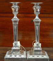 Lot 711 - † A pair of early 20th Century candlesticks,...