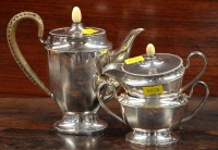 Lot 717 - AN EPNS bachelor's three-piece tea service,...