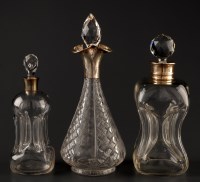 Lot 746 - A George V hourglass decanter with silver rim,...