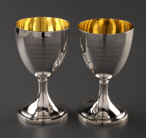 Lot 837 - A pair of George III chalices, by John...